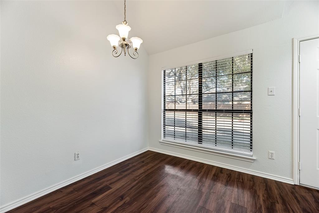 449 Harris Street, Unit 101L Coppell, TX 75019 - Photo 2 of 22 a view of empty room with wooden floor and fan