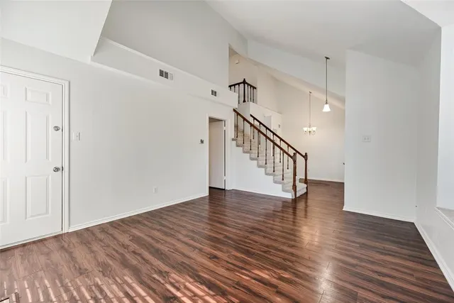 a view of an entryway with wooden floor