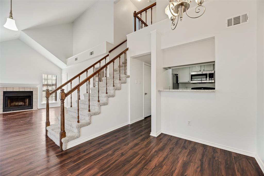 449 Harris Street, Unit 101L Coppell, TX 75019 - Photo 5 of 22 a view of entryway and hall with wooden floor