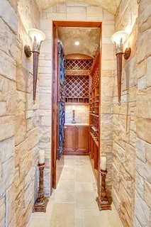 a kitchen with white cabinets and appliances