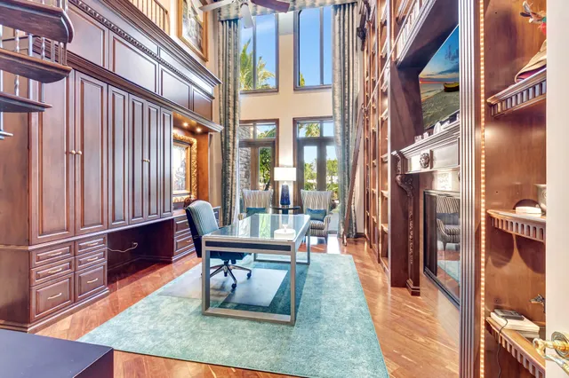 a large bathroom with double vanity sinks a large mirror and a bathtub