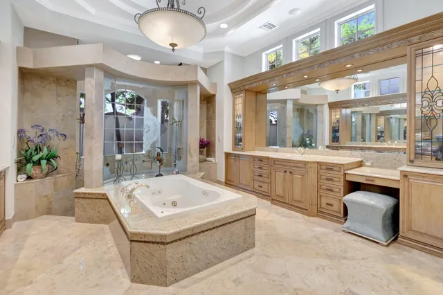 a living room with furniture and potted plant