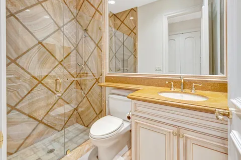 a spacious bedroom with a bed and a walk in closet