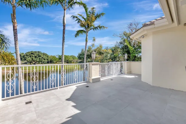 a bathroom with a granite countertop bathtub sink and toilet