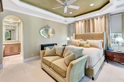 a view of backyard with outdoor seating and green space