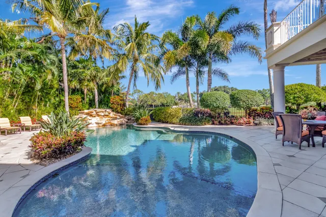 a view of a lake with houses in the back