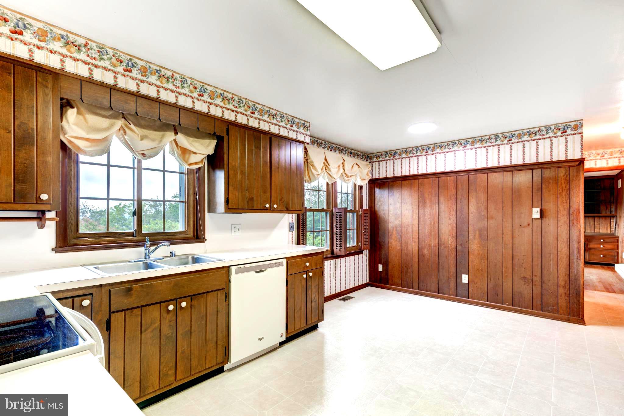 61 Ridge Road Westminster, MD 21157 - Photo 15 of 45 a large kitchen with stainless steel appliances granite countertop a sink and cabinets