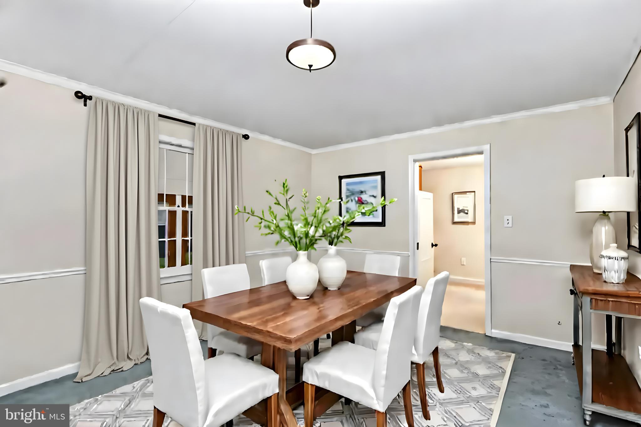 61 Ridge Road Westminster, MD 21157 - Photo 24 of 45 a dining room with furniture a potted plant and wooden floor