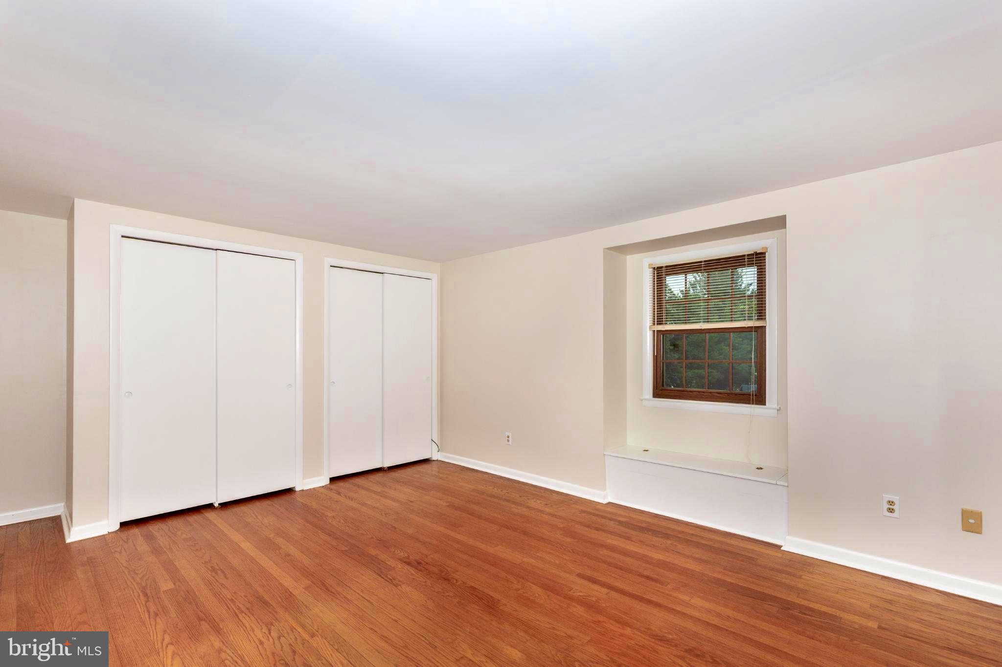 61 Ridge Road Westminster, MD 21157 - Photo 26 of 45 an empty room with wooden floor and windows