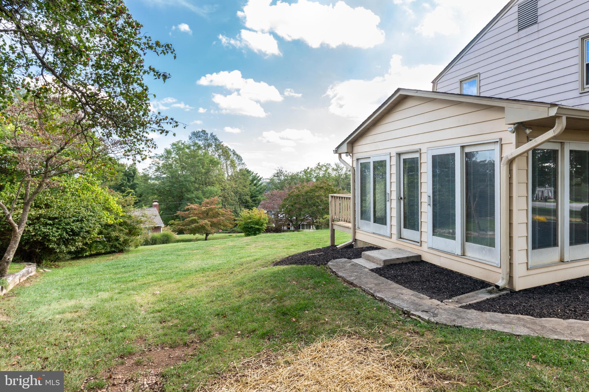 61 Ridge Road Westminster, MD 21157 - Photo 3 of 45 a view of a backyard with a garden