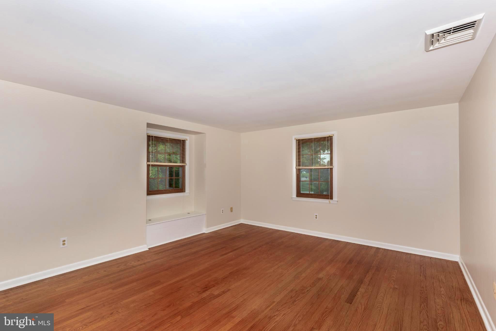 61 Ridge Road Westminster, MD 21157 - Photo 31 of 45 an empty room with wooden floor and windows