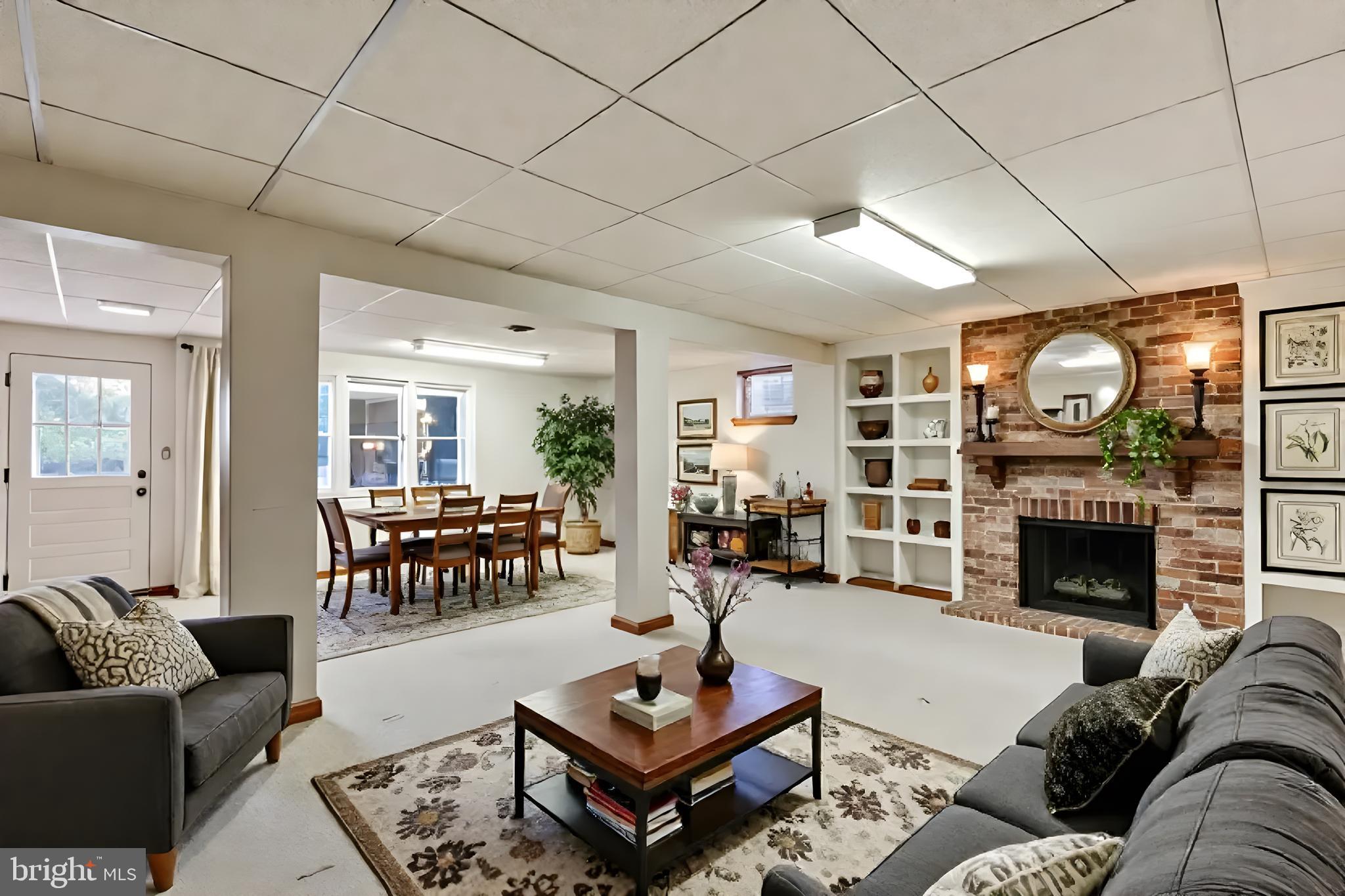 61 Ridge Road Westminster, MD 21157 - Photo 40 of 45 a living room with furniture flat screen tv and a fireplace