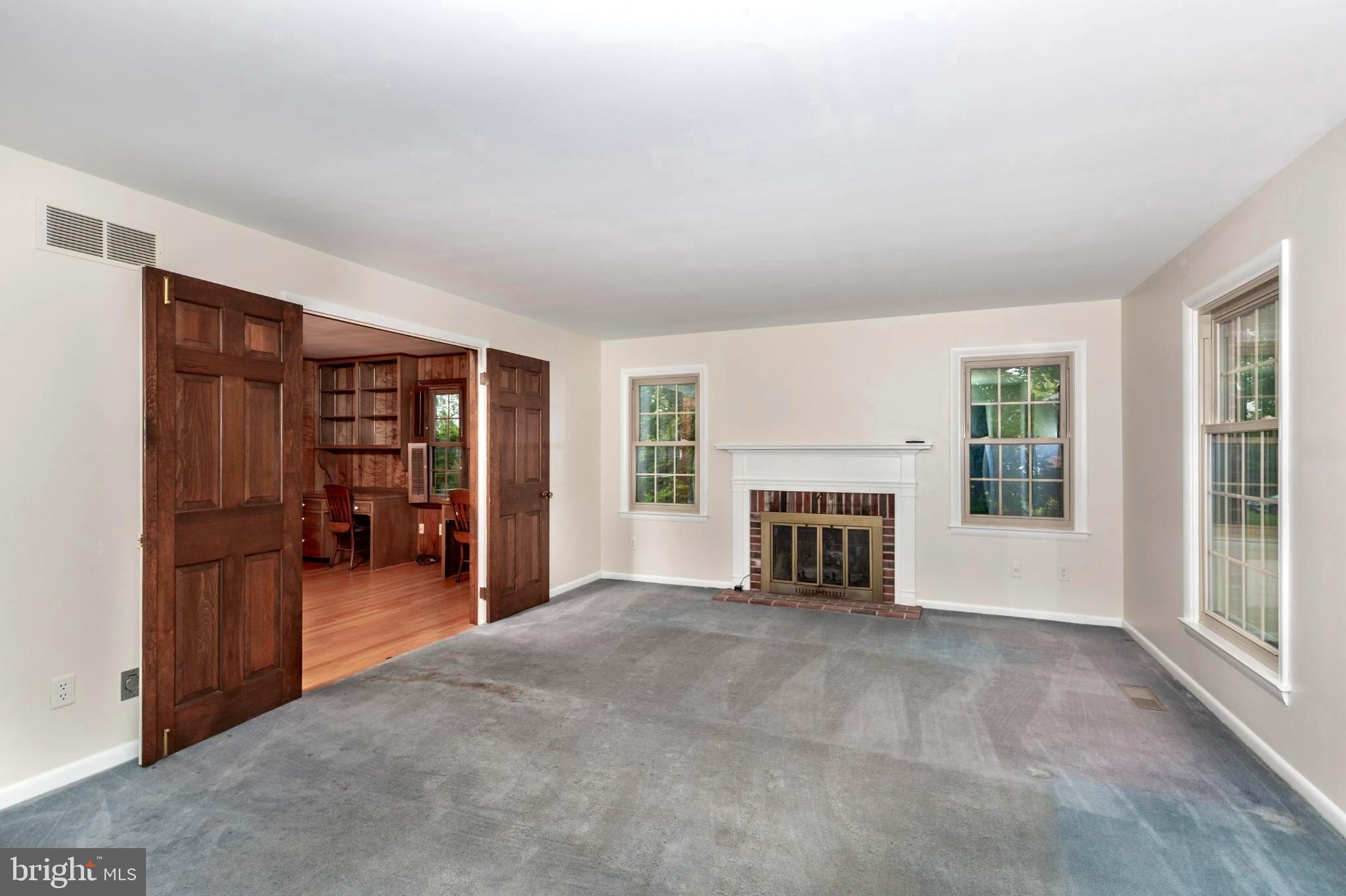 61 Ridge Road Westminster, MD 21157 - Photo 6 of 45 an empty room with furniture and fireplace