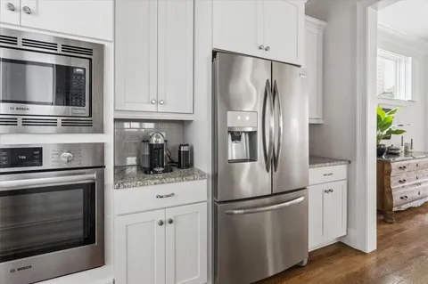 a kitchen with stainless steel appliances a refrigerator stove and microwave