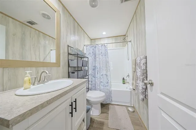 a bedroom with a bed and cabinets