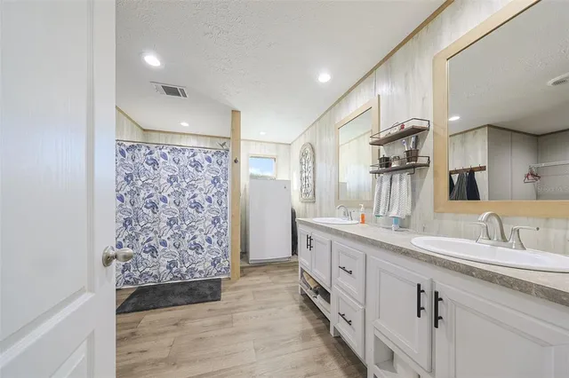 a living room with furniture and a dresser