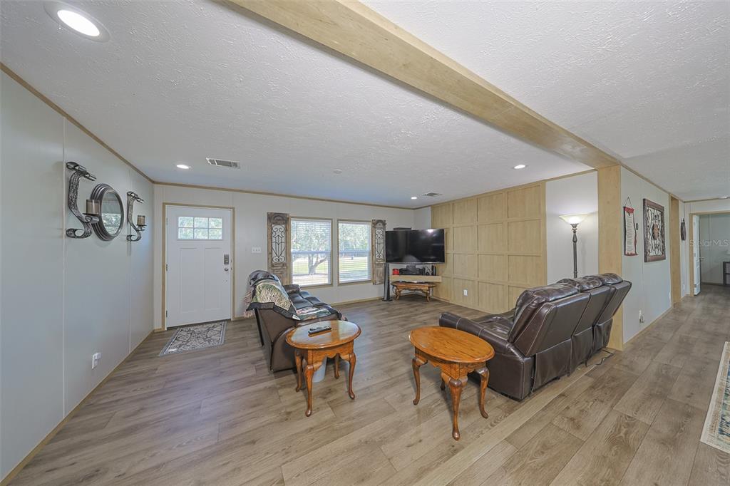 12124 Redrose Avenue Weeki Wachee, FL 34614 - Photo 29 of 57 a living room with furniture and wooden floor
