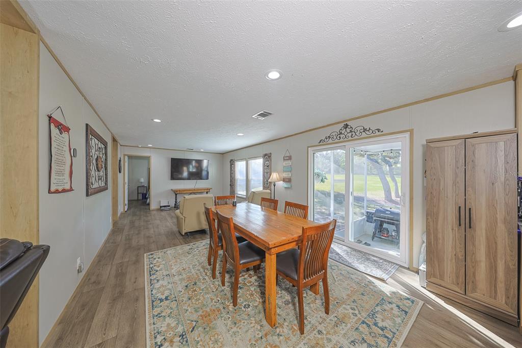12124 Redrose Avenue Weeki Wachee, FL 34614 - Photo 30 of 57 a dining room with furniture and window
