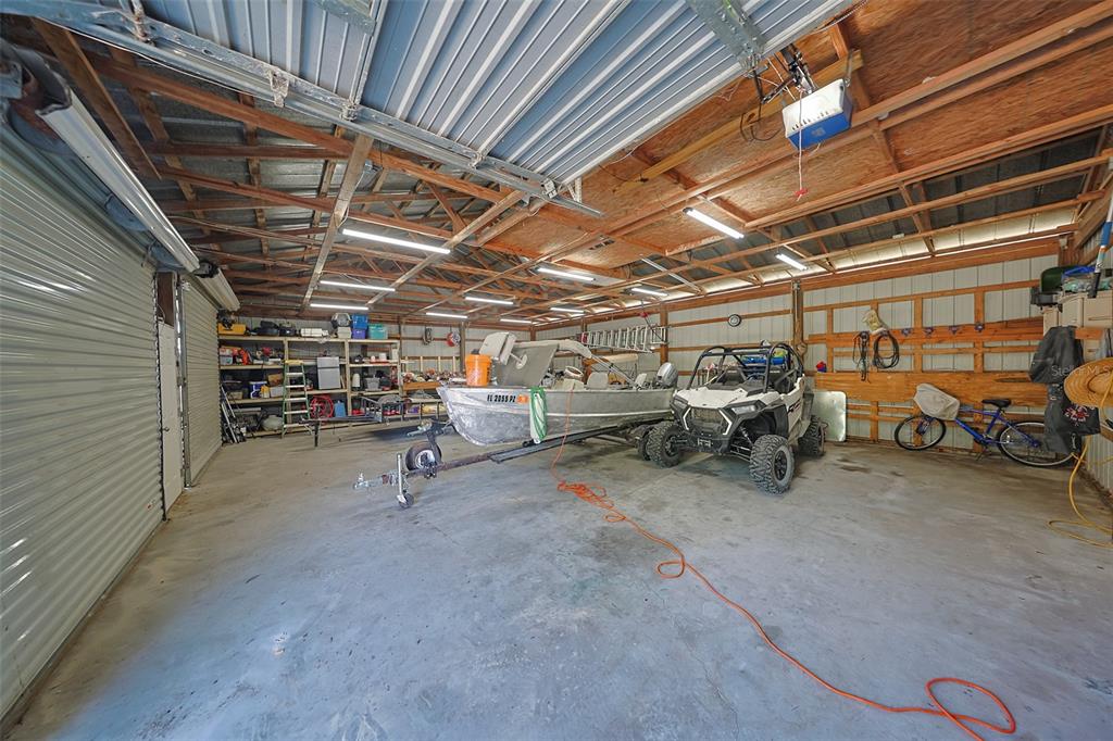 12124 Redrose Avenue Weeki Wachee, FL 34614 - Photo 40 of 57 a view of parking garage with cars