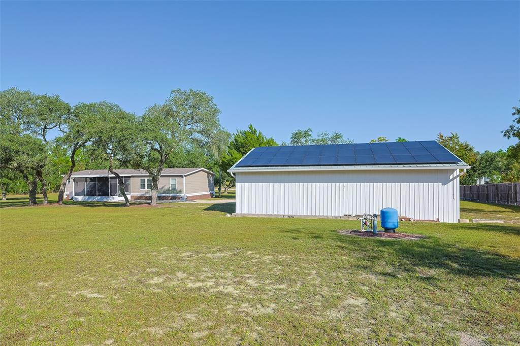 12124 Redrose Avenue Weeki Wachee, FL 34614 - Photo 45 of 57 a front view of a house with a yard