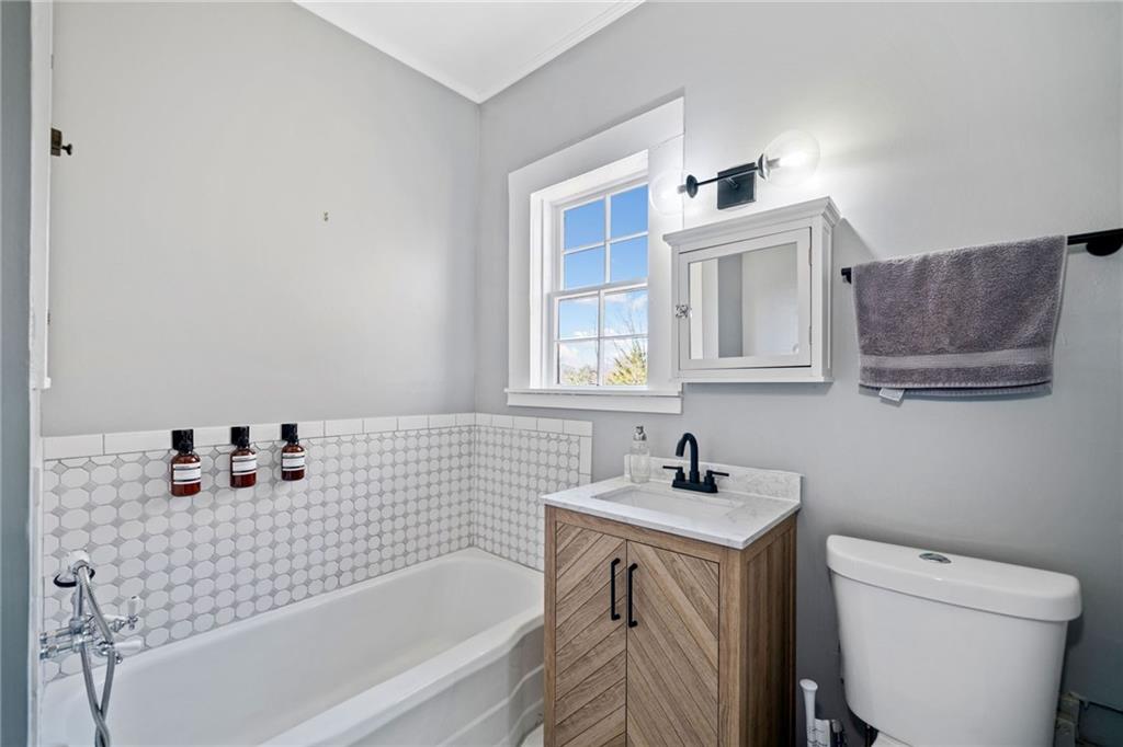 634 South Main Street Jasper, GA 30143 - Photo 14 of 39 a bathroom with a sink a toilet and bathtub