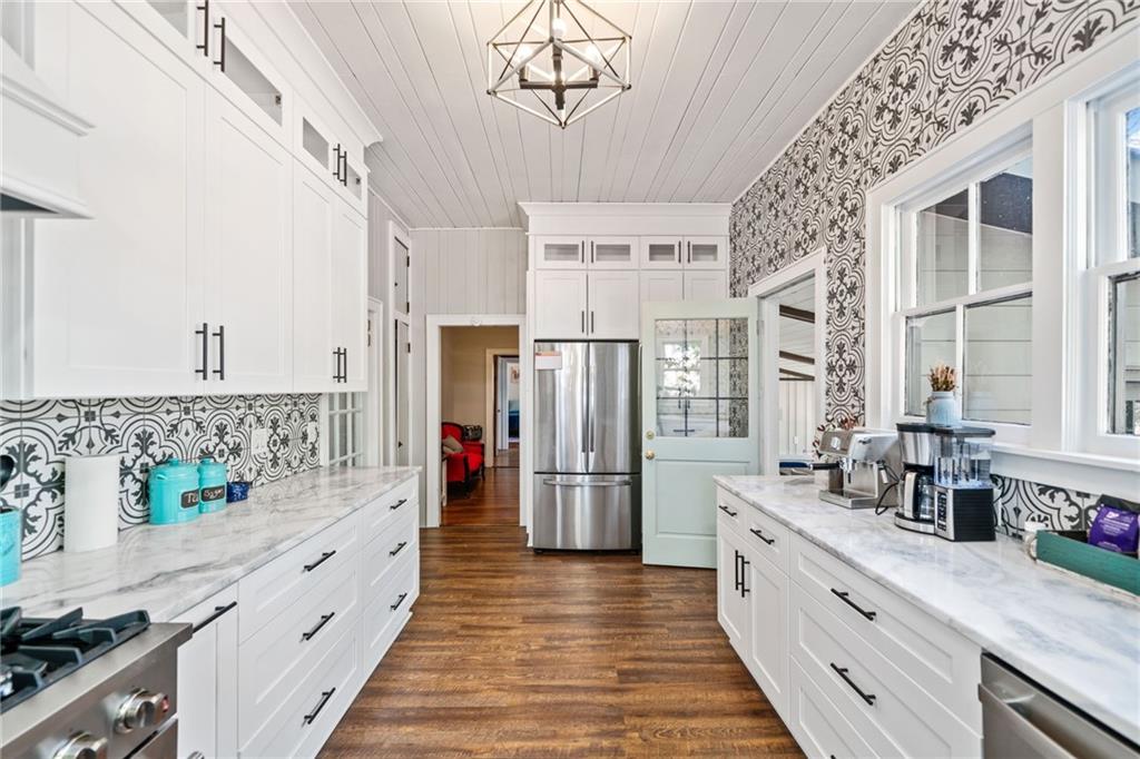 634 South Main Street Jasper, GA 30143 - Photo 18 of 39 a kitchen with refrigerator and cabinets