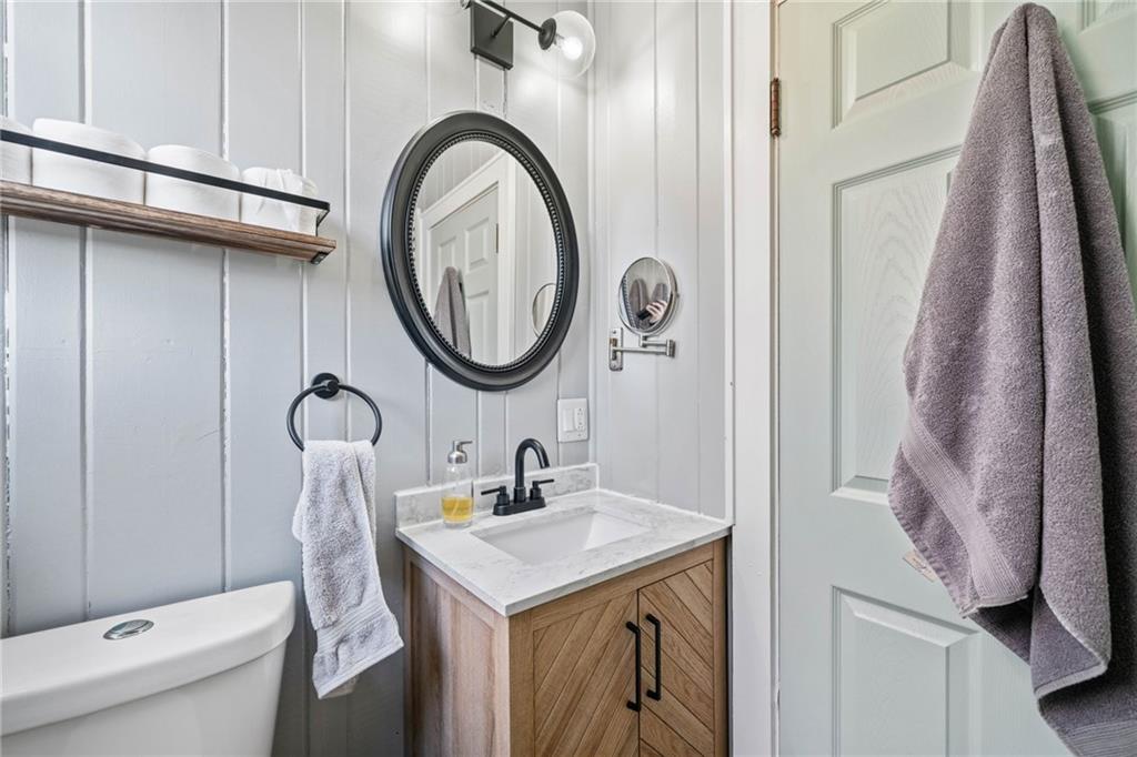 634 South Main Street Jasper, GA 30143 - Photo 20 of 39 a bathroom with a sink a toilet and a mirror
