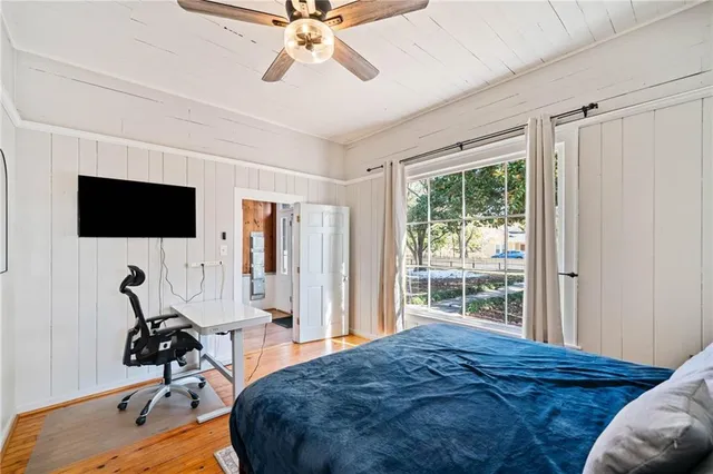 a view of a livingroom with furniture and a flat screen tv
