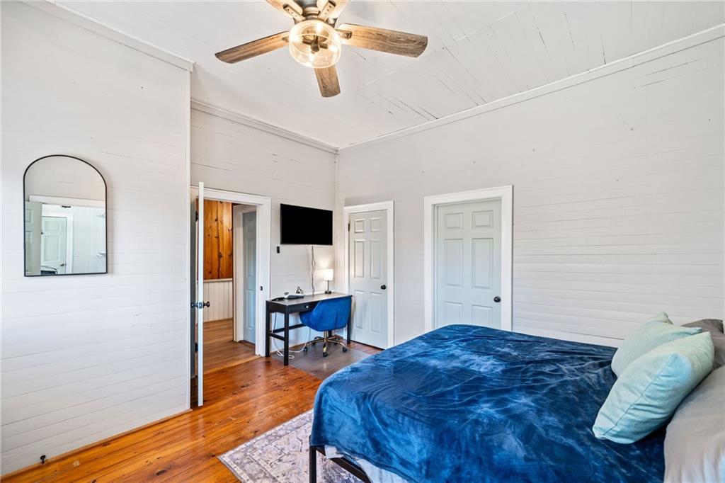 634 South Main Street Jasper, GA 30143 - Photo 25 of 39 a bedroom with a bed and a flat screen tv