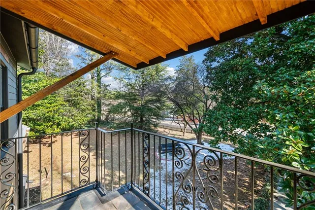 a view of street from balcony