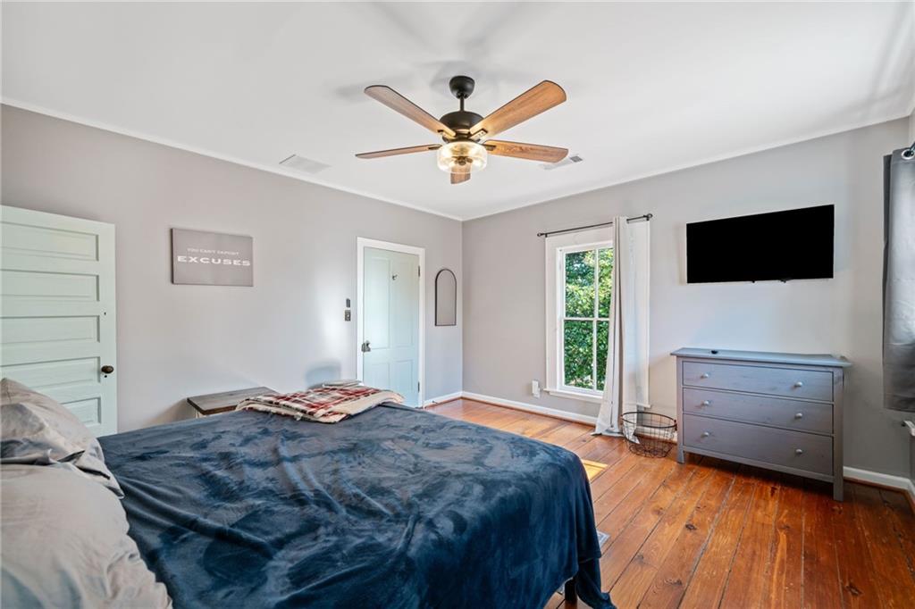 634 South Main Street Jasper, GA 30143 - Photo 6 of 39 a bedroom with a bed and a flat screen tv