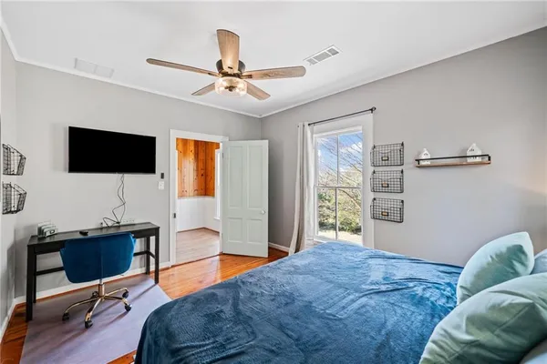 a bedroom with a workspace