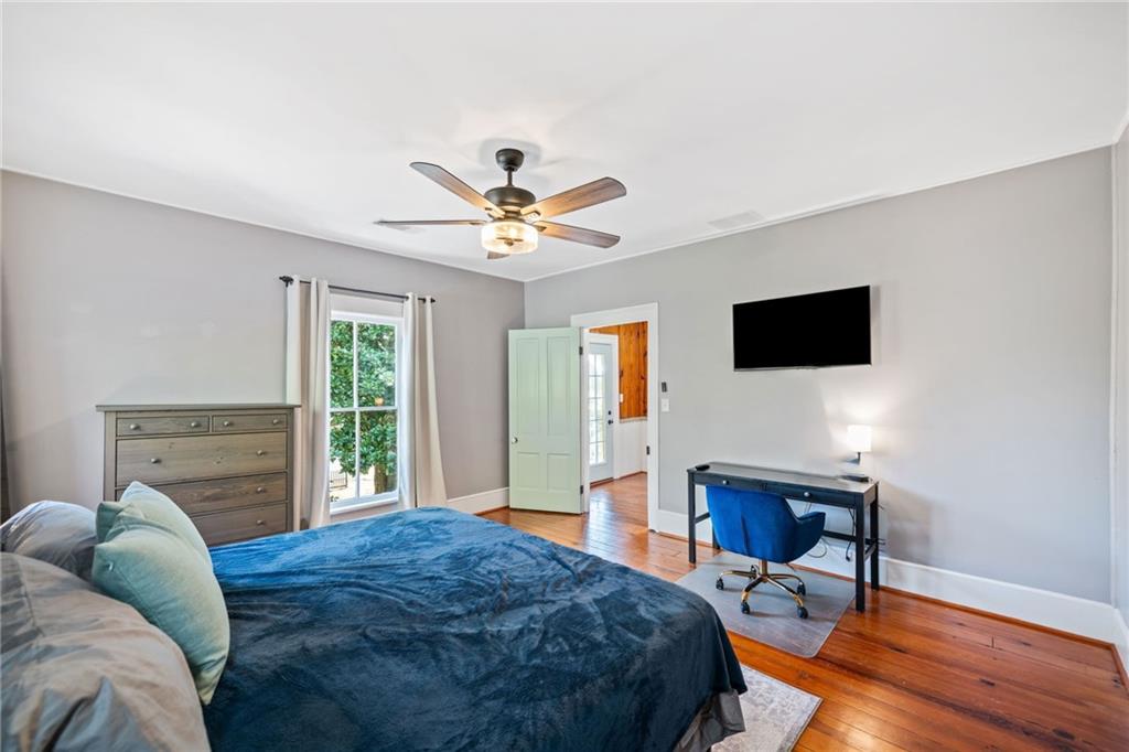 634 South Main Street Jasper, GA 30143 - Photo 10 of 39 a spacious bedroom with a bed and a television