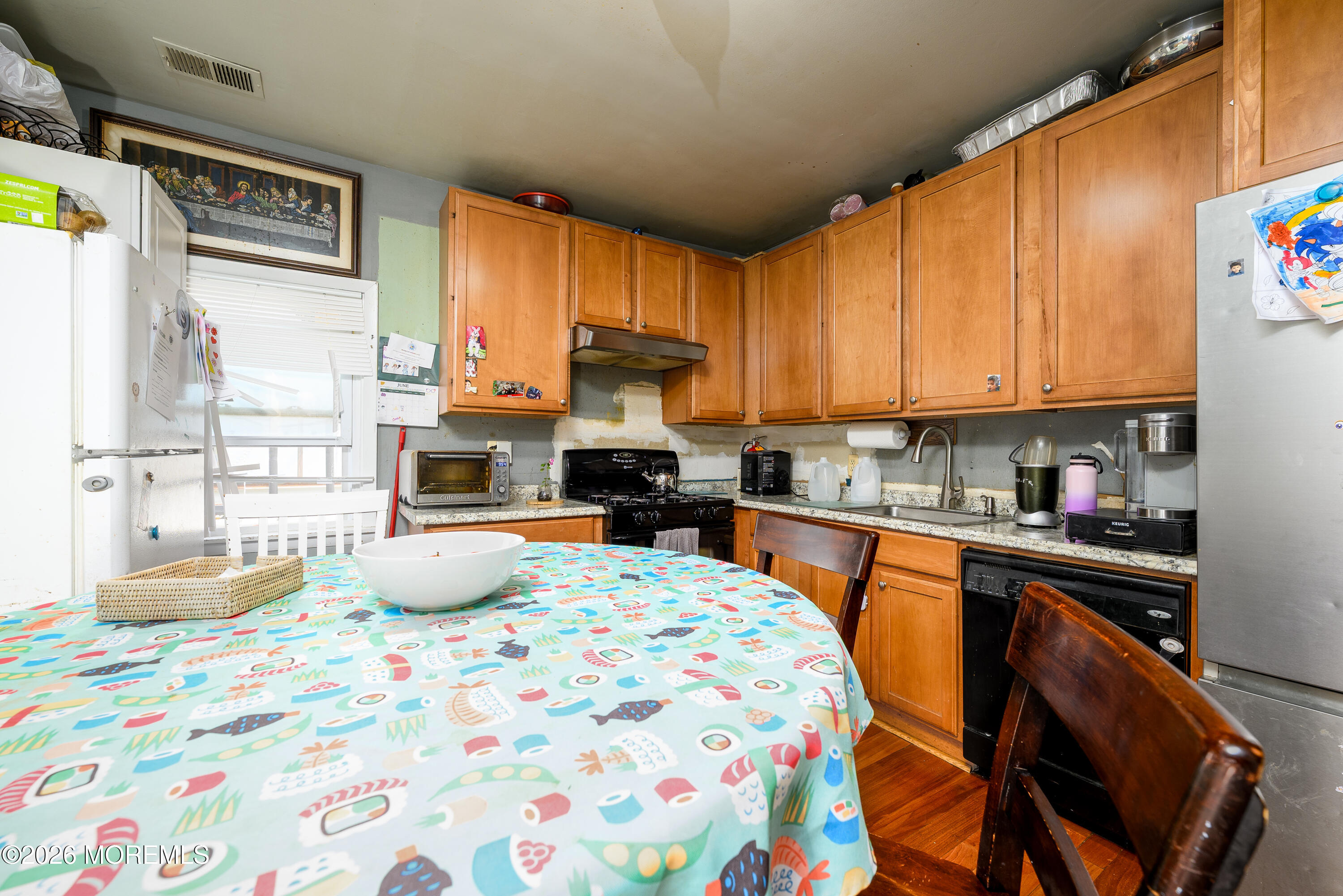 2nd Avenue, Unit 2 Long Branch, NJ 07740 - Photo 8 of 32 a kitchen with a sink a stove and a refrigerator
