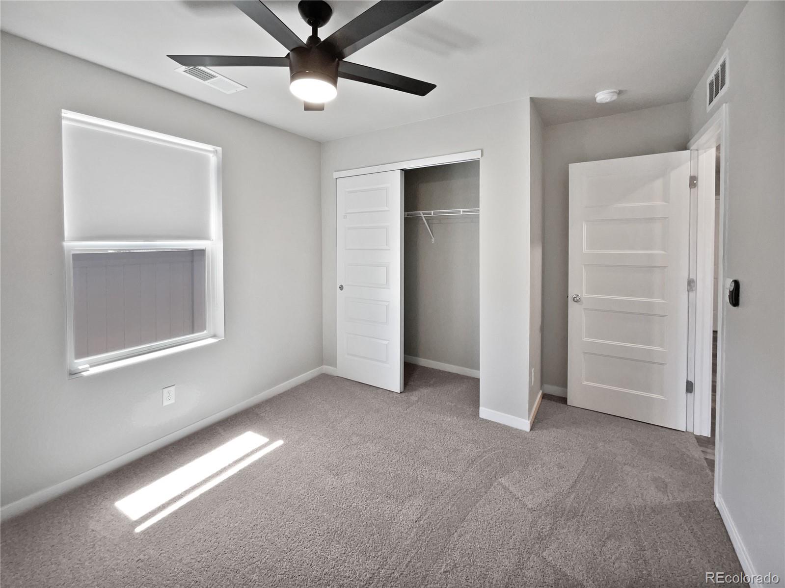 322 Bozeman Trail Ault, CO 80610 - Photo 11 of 19 a view of an empty room with a window