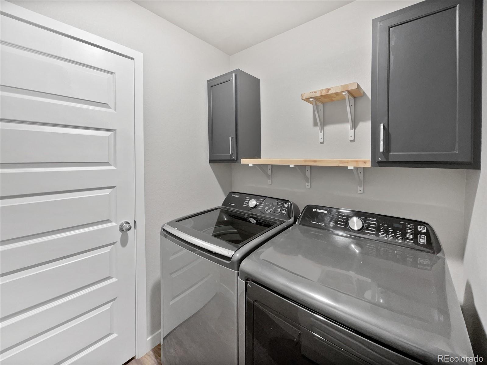 322 Bozeman Trail Ault, CO 80610 - Photo 12 of 19 a kitchen with a stove and a microwave