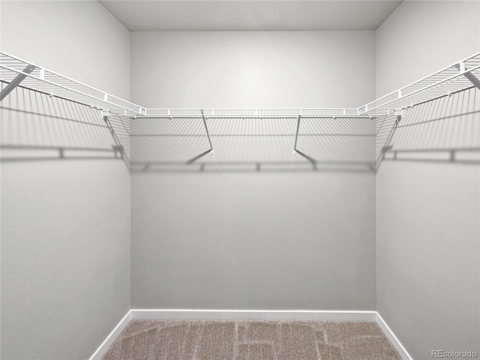 322 Bozeman Trail Ault, CO 80610 - Photo 19 of 19 a view of a room with racks on the wall