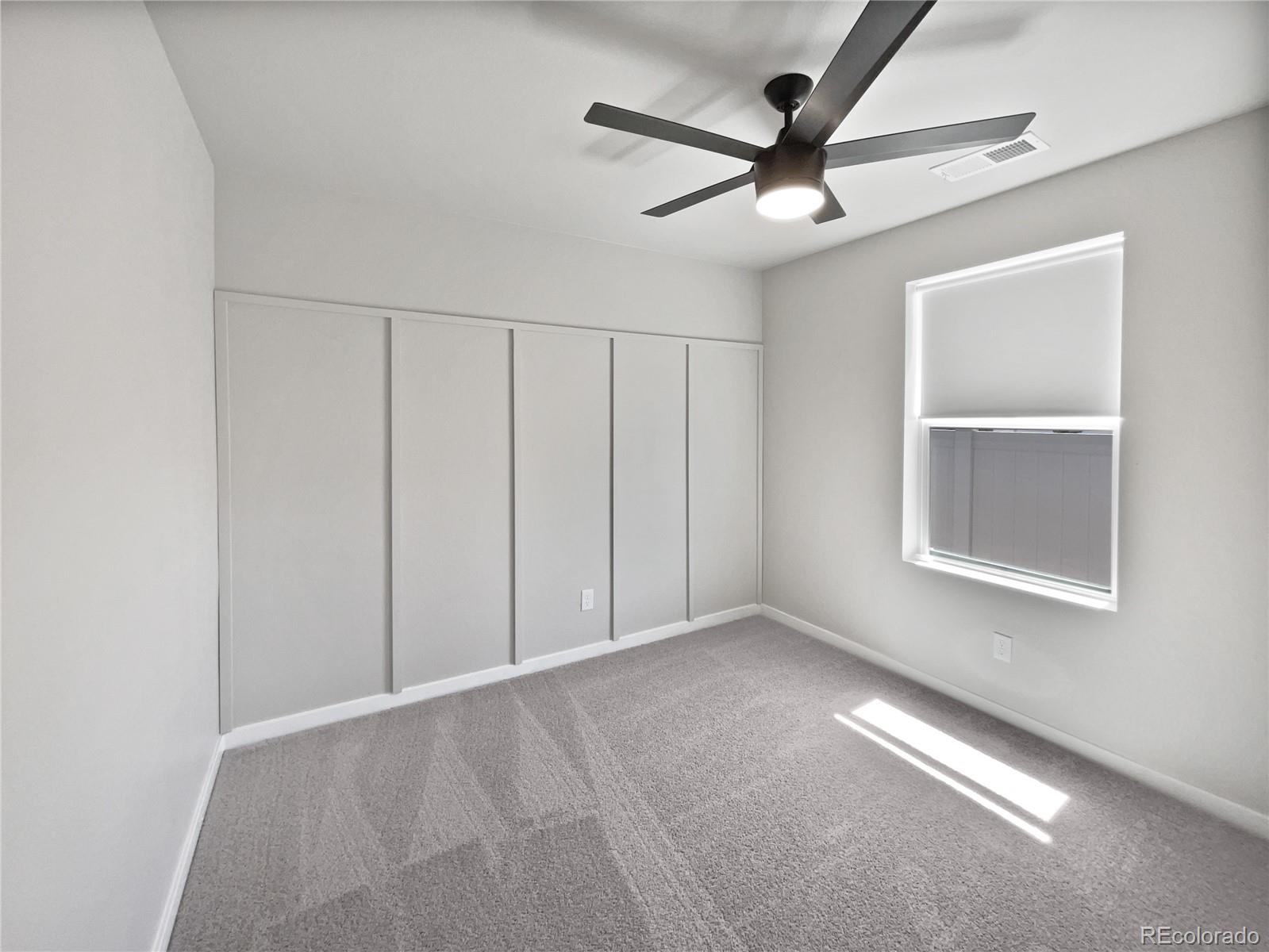 322 Bozeman Trail Ault, CO 80610 - Photo 5 of 19 a view of an empty room with a window