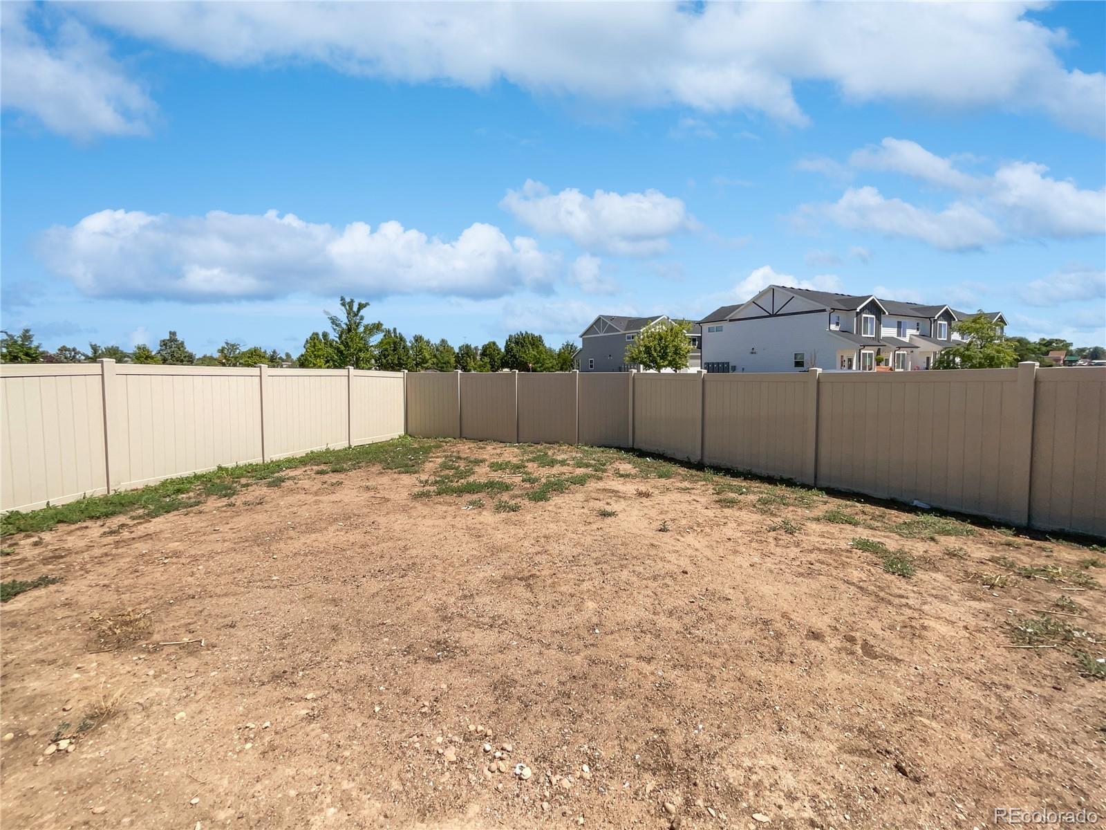 322 Bozeman Trail Ault, CO 80610 - Photo 7 of 19 a view of a backyard