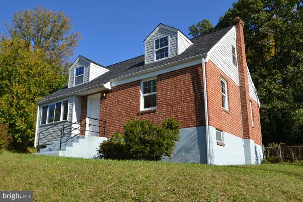 4405 Wakefield Road Baltimore, MD 21216 - Photo 1 of 17 a front view of a house with a yard