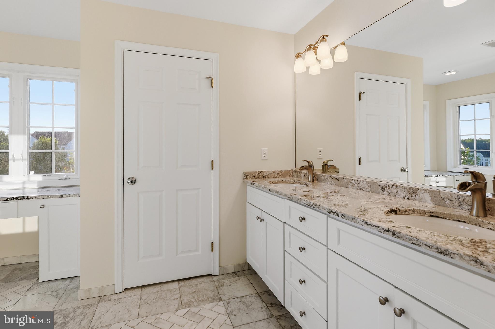 152 Springfield Circle Middletown, DE 19709 - Photo 12 of 29 a bathroom with a granite countertop sink and a mirror