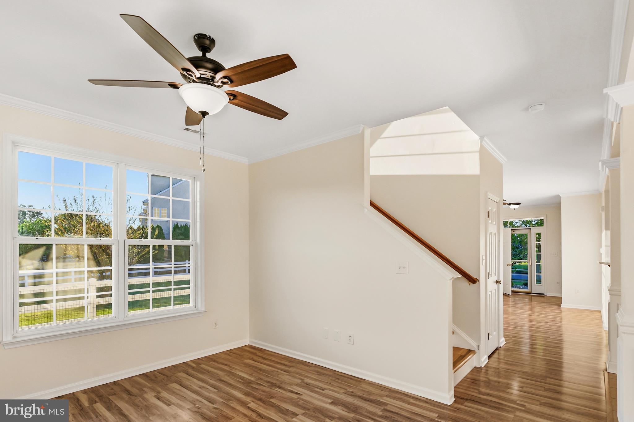 152 Springfield Circle Middletown, DE 19709 - Photo 14 of 29 a view of a room with wooden floor and windows
