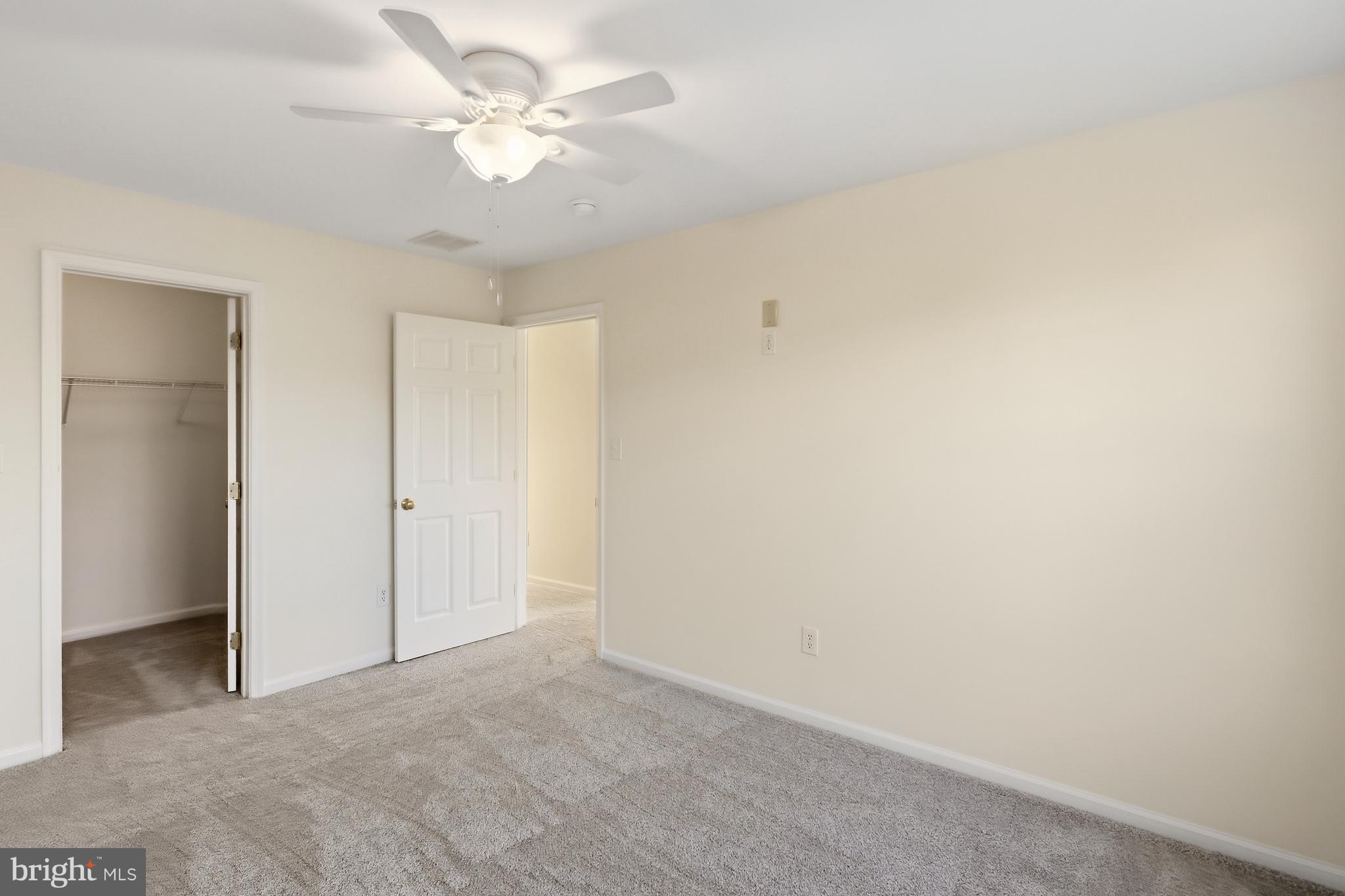152 Springfield Circle Middletown, DE 19709 - Photo 22 of 29 a view of a room with a ceiling fan and a window