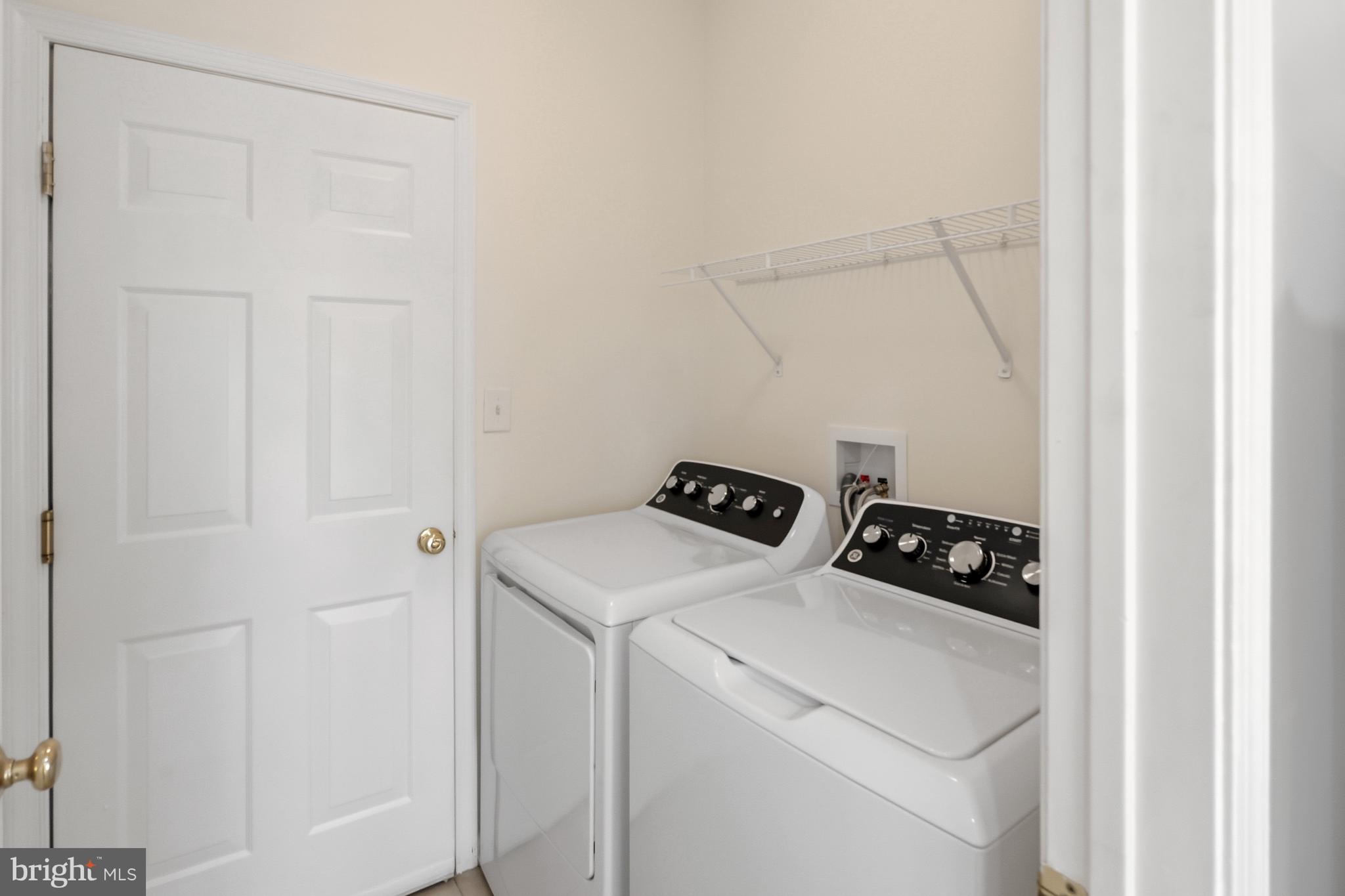 152 Springfield Circle Middletown, DE 19709 - Photo 27 of 29 a utility room with dryer and washer