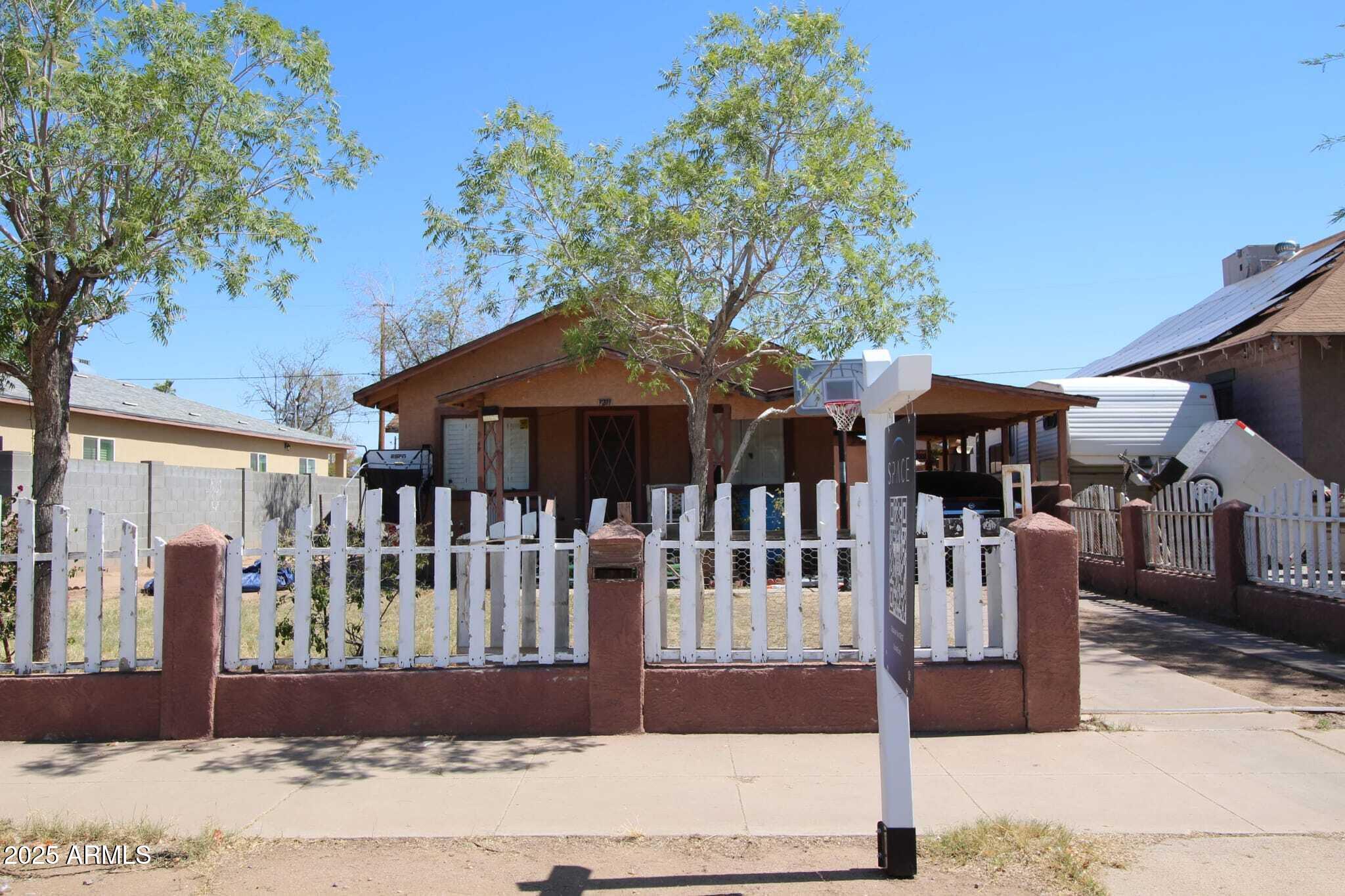 a view of a house with wooden deck
