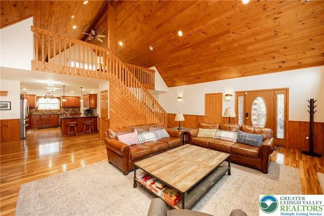 a spacious bedroom with a bed and a window