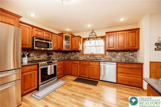 a spacious bedroom with a bed and window