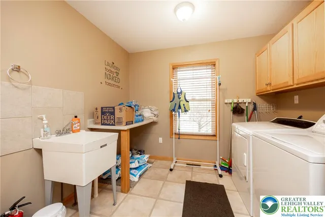 a living room with furniture a rug and a window