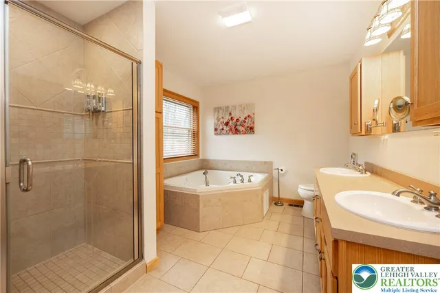 a view of a patio with table and chairs and wooden floor