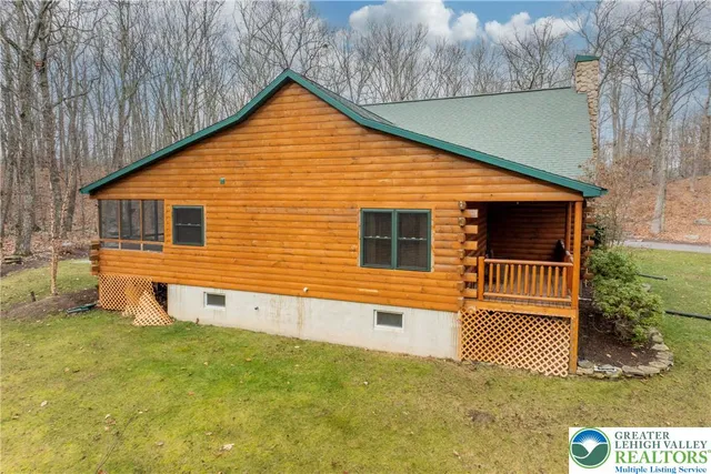 a living room with couch and a flat screen tv